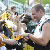 Ben signs autographs for cheering fans today.  