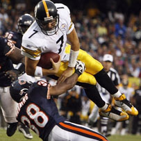 Ben leaps for a touchdown in the third quarter.
