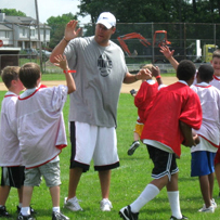 Ben high fives his team at the Mike Tomlin Football Camp.  Photo taken by Anita Doddroe. (Please do not copy the photo without her permission).